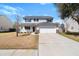 Charming home with a well-kept lawn and an attached two-car garage, offering curb appeal at 2508 Melville Rd, North Charleston, SC 29406