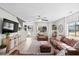 Inviting living room featuring hardwood floors, natural light, and comfortable leather sofas at 2508 Melville Rd, North Charleston, SC 29406