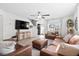 Cozy living room with hardwood floors, modern furniture, and lots of natural light at 2508 Melville Rd, North Charleston, SC 29406