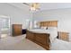 Large main bedroom features a ceiling fan, ensuite bathroom, and walk-in closet at 2508 Melville Rd, North Charleston, SC 29406