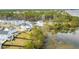 Aerial view shows the proximity to the marsh of this marsh community filled with white homes and lush landscaping at 3554 Clambank Dr, Mount Pleasant, SC 29466