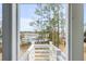 Beautiful marsh view from a home's light and bright balcony with white railings at 3554 Clambank Dr, Mount Pleasant, SC 29466