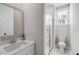Bright bathroom featuring white vanity, quartz countertop and a glass shower at 3554 Clambank Dr, Mount Pleasant, SC 29466