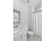 Bathroom features a shower with curtain, white vanity, and marble tile flooring at 3554 Clambank Dr, Mount Pleasant, SC 29466