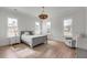 Cozy bedroom with a gray bed frame, ample natural light, and a woven light fixture at 3554 Clambank Dr, Mount Pleasant, SC 29466