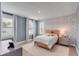 Charming bedroom with blue accents, a cozy bed, and cheerful wallpaper at 3554 Clambank Dr, Mount Pleasant, SC 29466