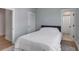 Bedroom with light blue walls, and two doors to the hall and bathroom at 3554 Clambank Dr, Mount Pleasant, SC 29466