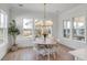 Bright dining room with wood floors, chandelier, and natural light at 3554 Clambank Dr, Mount Pleasant, SC 29466