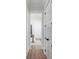 Hallway leading to dining room with wood floors and white trim at 3554 Clambank Dr, Mount Pleasant, SC 29466