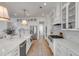 Bright kitchen features stainless appliances, island, and white cabinetry at 3554 Clambank Dr, Mount Pleasant, SC 29466