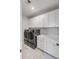 Laundry room with gray washer and dryer, white cabinets and countertop at 3554 Clambank Dr, Mount Pleasant, SC 29466