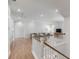 Upstairs living room boasts an open floorplan, light-colored wood flooring, and neutral decor at 3554 Clambank Dr, Mount Pleasant, SC 29466