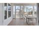 Inviting screened porch with a dining table, ideal for outdoor dining and relaxation at 3554 Clambank Dr, Mount Pleasant, SC 29466