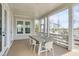Charming porch with wood table, chairs, and stunning views of the water and marsh at 3554 Clambank Dr, Mount Pleasant, SC 29466