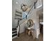 Elegant foyer with a wooden staircase, decorative lighting, and a console table with decor at 365 Trailmore Ln, Summerville, SC 29486