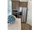 Well-equipped kitchen with stainless steel refrigerator and microwave adjacent to white countertops at 365 Trailmore Ln, Summerville, SC 29486
