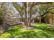 Beautiful backyard with a luxurious pool and spa, a lush lawn, and shade from mature trees at 4008 Cameron Blvd, Isle of Palms, SC 29451