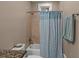 Cozy bathroom features a shower with blue patterned curtain and decorative tiles at 4008 Cameron Blvd, Isle of Palms, SC 29451