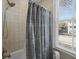 Cozy bathroom with shower-tub combination and natural light at 4008 Cameron Blvd, Isle of Palms, SC 29451
