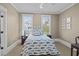 Bedroom with two windows offering natural light and a decorative fish-themed bedspread at 4008 Cameron Blvd, Isle of Palms, SC 29451