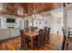 The dining room features a large wooden table, hardwood floors, and modern lighting at 4008 Cameron Blvd, Isle of Palms, SC 29451