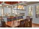 Dining room with wooden table, modern lighting, and a view into the bright kitchen at 4008 Cameron Blvd, Isle of Palms, SC 29451