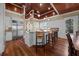 Spacious kitchen with white cabinets, granite countertops, stainless steel appliances, and wood floors at 4008 Cameron Blvd, Isle of Palms, SC 29451