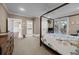 Bedroom with hardwood floors, a four poster bed, and an ensuite bathroom at 4008 Cameron Blvd, Isle of Palms, SC 29451