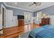 Bright bedroom features beautiful hardwood floors, light blue walls, and a ceiling fan at 4008 Cameron Blvd, Isle of Palms, SC 29451
