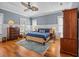 Comfortable bedroom with hardwood floors, ceiling fan, and natural light at 4008 Cameron Blvd, Isle of Palms, SC 29451