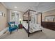 Bedroom with a four poster bed, a comfortable chair, and ample natural light at 4008 Cameron Blvd, Isle of Palms, SC 29451