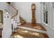 Staircase with an antique clock and a large window, offering plenty of natural light at 4008 Cameron Blvd, Isle of Palms, SC 29451