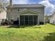 A pleasant backyard with a lawn, deck, and screened-in porch at 415 Aberdeen Cir, Summerville, SC 29483
