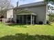 A pleasant backyard with a lawn, deck, and screened-in porch at 415 Aberdeen Cir, Summerville, SC 29483