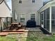 Backyard featuring a deck, patio, grill, and access to a screened porch at 415 Aberdeen Cir, Summerville, SC 29483