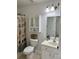 Bright bathroom featuring a toilet, vanity, and decorative shower curtain at 415 Aberdeen Cir, Summerville, SC 29483