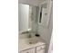 Bathroom vanity and shower are reflected in the large bathroom mirror at 415 Aberdeen Cir, Summerville, SC 29483