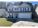 Charming two-story home with attached two-car garage, well-maintained lawn, and classic curb appeal at 415 Aberdeen Cir, Summerville, SC 29483