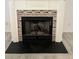 Close-up of the tiled fireplace with a black mantel at 415 Aberdeen Cir, Summerville, SC 29483