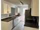 Beautiful kitchen with white cabinets, stainless appliances, and gray wood flooring at 415 Aberdeen Cir, Summerville, SC 29483