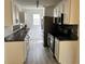 Charming kitchen featuring stainless steel appliances, white cabinets, and modern fixtures at 415 Aberdeen Cir, Summerville, SC 29483