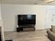 Living room showcasing a large television and view of the fireplace at 415 Aberdeen Cir, Summerville, SC 29483