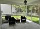 Cozy screened porch with comfortable seating and an outdoor view at 415 Aberdeen Cir, Summerville, SC 29483