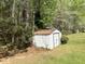 A small metal shed set back in a wooded lot at 415 Aberdeen Cir, Summerville, SC 29483
