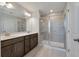 Contemporary bathroom with double sinks, vanity, and tiled shower with glass doors at 416 Duskywing Dr, Goose Creek, SC 29445