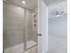 Bathroom featuring a tiled shower with glass door next to a bedroom at 416 Duskywing Dr, Goose Creek, SC 29445