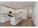 Spacious kitchen with white cabinets, stainless steel appliances, and a center island at 416 Duskywing Dr, Goose Creek, SC 29445