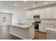 Modern kitchen features stainless steel appliances and an island with a marble countertop at 416 Duskywing Dr, Goose Creek, SC 29445