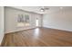Bright living room features wood-look floors, recessed lighting, and a large window overlooking a treed lot at 416 Duskywing Dr, Goose Creek, SC 29445