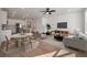 Bright open-concept living space with hardwood floors, modern furniture, and a stylish kitchen at 416 Duskywing Dr, Goose Creek, SC 29445